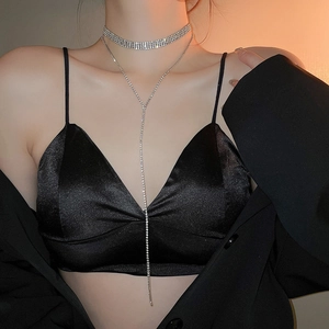 Close-up of sparkling layered rhinestone choker with elegant dangling Y-shape chain on model