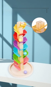 Detailed view of rainbow wooden music tree petals and color gradient marble run track
