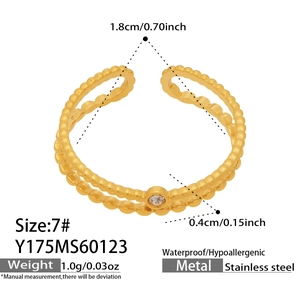 Detailed view of gold beaded stainless steel ring with waterproof and hypoallergenic tags