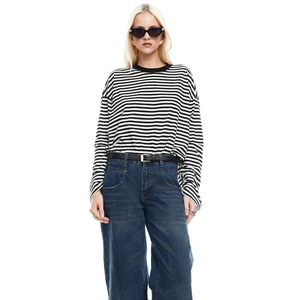 Slim fit long sleeve striped t-shirt for women paired with denim wide leg trousers