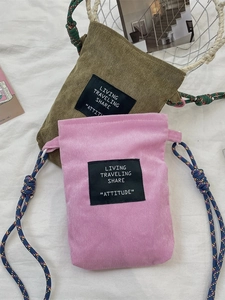 Corduroy drawstring crossbody phone bag in olive green and pink with woven straps