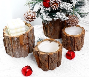 Detail view of natural bark candle holders for Christmas decor with festive pine cones