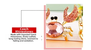 Detailed macro view of crab keychain featuring pink gemstones and sparkling Czech rhinestones