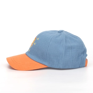 Detail of color-block kids baseball cap with lion sun embroidery and textured cotton fabric