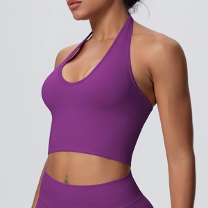 Detail view of seamless ribbed halter neck yoga bra in deep purple with V-neck design