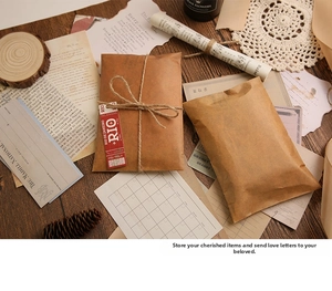 Detail of vintage kraft paper envelopes with twine ties and wax seal decorative accents