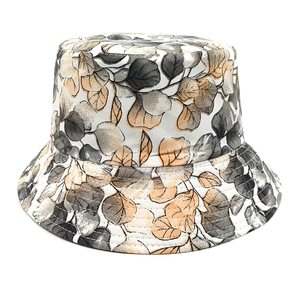 Detail of artistic leaf print on sun hat with reinforced parallel brim stitching lines