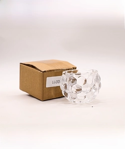 Detail showing the textured glass candle holder and its 8.5x8.5x5.5cm packaging box