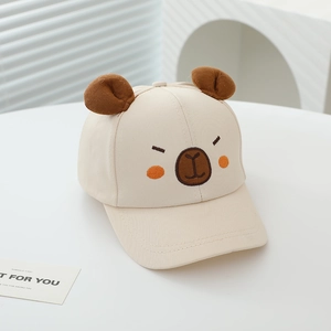 Detailed view of beige cotton kids cap with cute bear ears and embroidered bear face