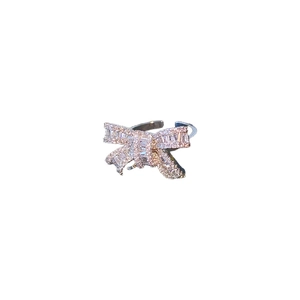 Silver bow hollow open ring with zircon pavé setting on a clean white background