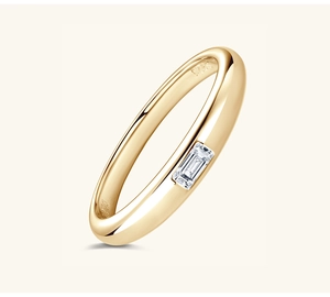 Detail shot of rectangular moissanite stone and S925 silver hallmark on gold-plated ring