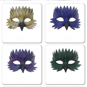 Detail view of four colorful masquerade bird masks with textured feathers and pointed beaks