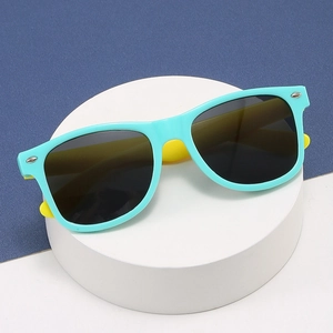 Blue and yellow contrast frame kids sunglasses on display stand with dark lenses