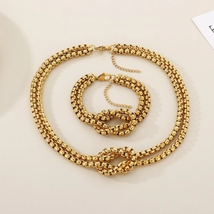 Two-tone gold and silver layered knot necklace and bracelet set in stainless steel