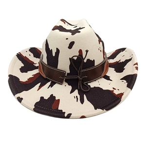 Western cow print felt cowboy hat with vintage brown leather band and decorative knot