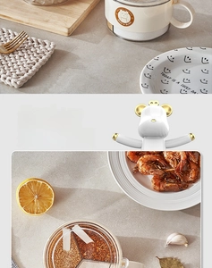 Three-compartment cream spice box with gold bear handle and matching sealing clip detail