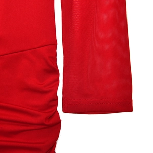 Detailed view of red evening dress fabric texture and side ruching stitching