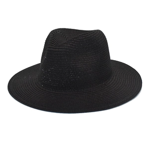 Detailed close-up of the black straw fedora showing high-quality woven texture and crown