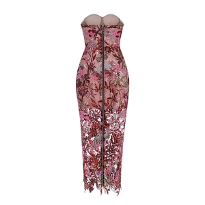 Detailed close-up of intricate floral embroidery and sequins on a mesh off-shoulder dress