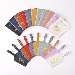 Close-up of colorful PU leather passport covers and luggage tags with gold map foil