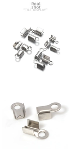 Macro view showing the U-shaped stainless steel crimp connectors for jewelry making