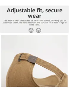 Close-up of adjustable metal buckle on khaki twill cotton baseball cap for custom fit