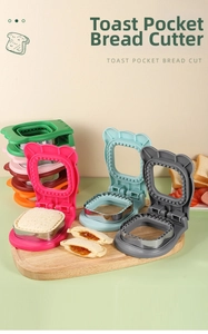 Detail showing colorful stainless steel sandwich cutters with bear-ear handles for DIY crustless bread