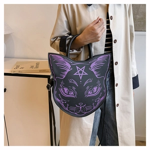 Detail of gothic black cat head bag with purple star print and adjustable shoulder strap