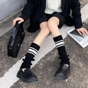 Y2K style black knitted leg warmers with white stripes for women in academic aesthetic