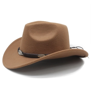 Detailed view of brown felt cowboy hat with braided band and silver metal leaf accents