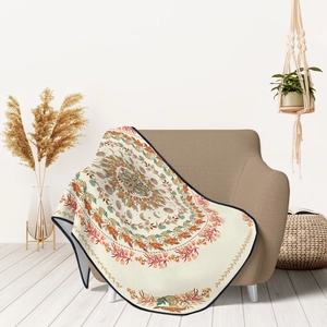 Detailed view of bohemian mandala round throw with moon phases and mushroom patterns