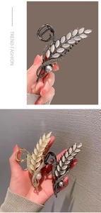 Detailed close-up of wheat ear hair claws with sparkling rhinestones and elegant pearls