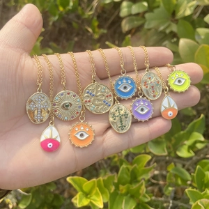Gold stainless steel cross and evil eye charm necklaces set with colorful enamel pendants