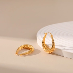 Classic 18K gold plated brass twisted rope hoop earrings on a white minimalist base