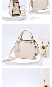 Detail of cream semi-circular handbag with golden leaf pendant and smooth PU texture