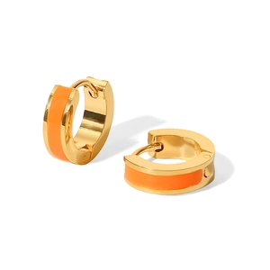 Detail of 18K gold plated stainless steel hoop earrings with orange enamel inlay