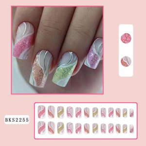 Close-up of pink and green long press-on nails with silver lines and crackle patterns