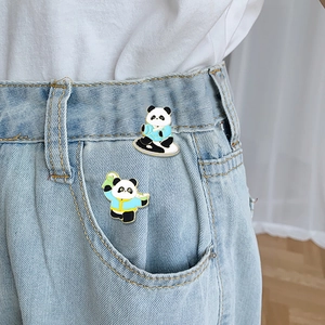 Panda enamel pins set with traditional Chinese costumes worn on denim jeans pocket