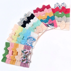 Set of 5 colorful nylon baby headbands with assorted bow designs and floral patterns