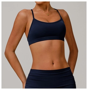 Detail of navy blue high-stretch yoga sports bra and leggings with pleated waistband