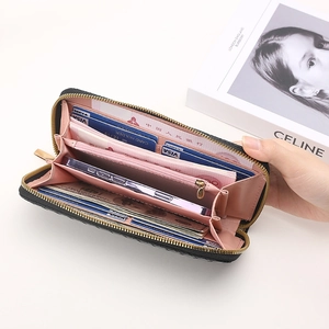 Black long zip-around wallet with pink lining and multi-functional internal card slots