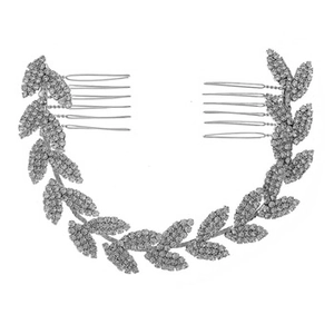 Detailed view of silver bridal hair comb with rhinestone leaves and metallic teeth