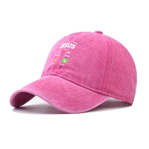 Detail of pink washed cotton baseball cap featuring Jesus Calling graphics and worn texture