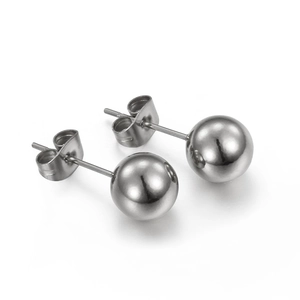 Polished silver stainless steel ball stud earrings with butterfly backs on white background