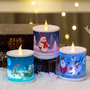 Three Christmas LED flameless candles with Santa, reindeer and snowman festive patterns
