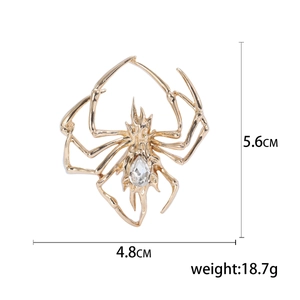 Golden spider brooch with crystal inlay, dimensions 4.8x5.6cm, polished metal finish