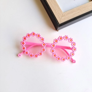 Pink daisy flower shaped round frame sunglasses for kids with candy color design