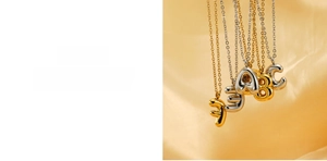 Detail of 18K gold plated bubble initial pendants showing lead-free and nickel-free quality