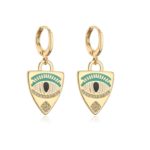Detailed view of gold plated shield earrings with evil eye enamel and zircon stones