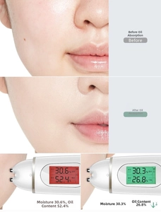 Digital skin analyzer showing significant oil reduction after using blotting paper